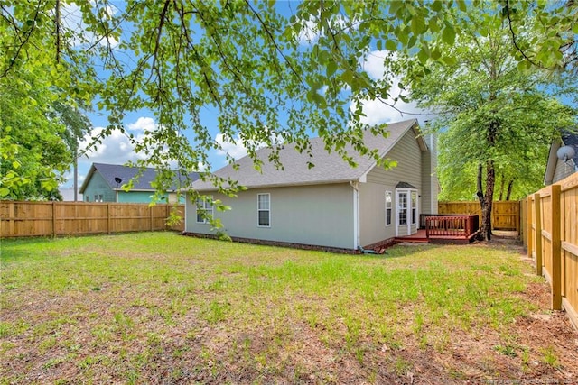 back of house featuring a deck