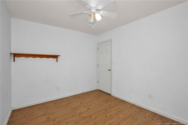3632 Lubbock Dr, Hope Mills, NC 28348 - spare room with wood finished floors, baseboards, a textured ceiling, and ceiling fan