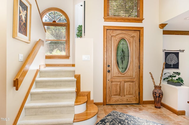 108 Hanover Pl, Chapel Hill, NC 27516 - tiled entrance foyer with stairs and baseboards