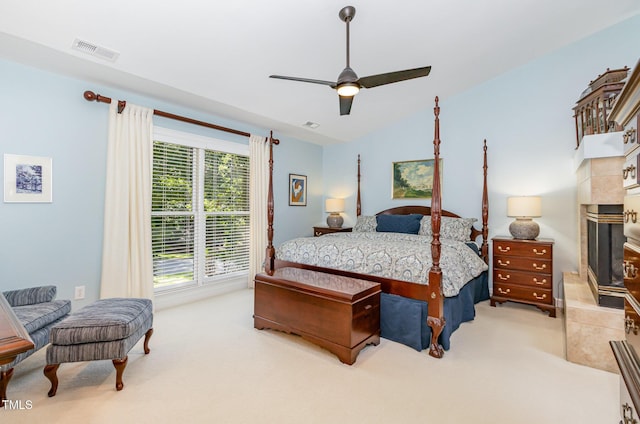 108 Hanover Pl, Chapel Hill, NC 27516 - bedroom featuring light colored carpet, a ceiling fan, and a tile fireplace