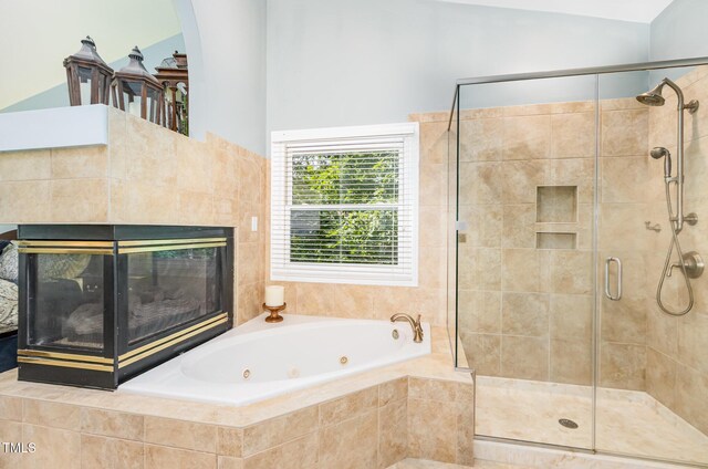 108 Hanover Pl, Chapel Hill, NC 27516 - bathroom featuring a whirlpool tub, a stall shower, and a fireplace