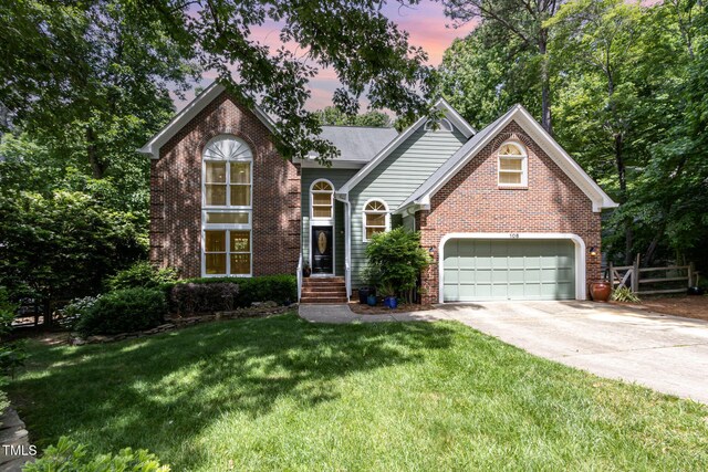 108 Hanover Pl, Chapel Hill, NC 27516 - traditional-style home with brick siding, concrete driveway, and a front lawn