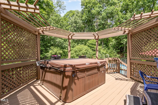 108 Hanover Pl, Chapel Hill, NC 27516 - wooden terrace featuring a hot tub, a pergola, and view of wooded area