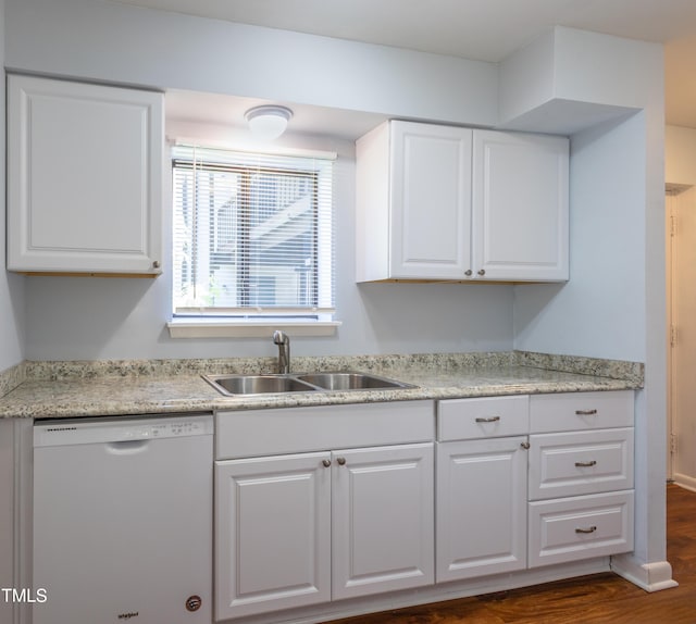 kitchen with white dishwasher, a sink, white cabinetry, dark wood finished floors, and light countertops