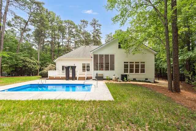 12301 Hardee Rd, Raleigh, NC 27614 - rear view of property featuring a deck, a sunroom, an outdoor pool, crawl space, and a lawn
