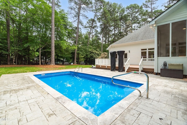 12301 Hardee Rd, Raleigh, NC 27614 - outdoor pool featuring a sunroom, a patio area, a wooden deck, and view of scattered trees