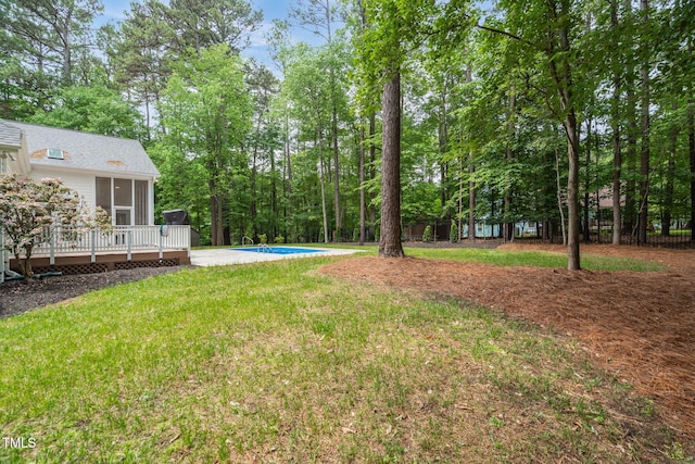 12301 Hardee Rd, Raleigh, NC 27614 - view of green lawn featuring a wooden deck, a sunroom, and an outdoor pool