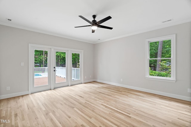 12301 Hardee Rd, Raleigh, NC 27614 - empty room featuring crown molding, baseboards, light wood-type flooring, and a ceiling fan