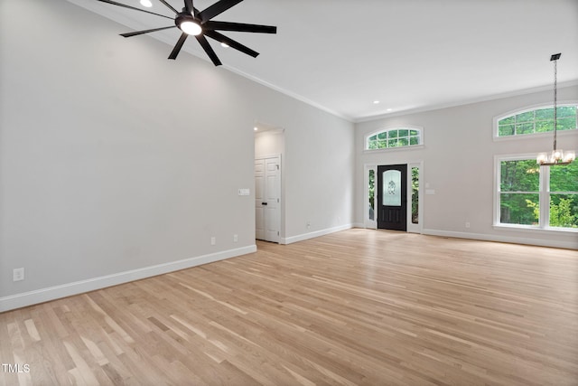 12301 Hardee Rd, Raleigh, NC 27614 - foyer with crown molding, a chandelier, light wood-type flooring, baseboards, and a ceiling fan
