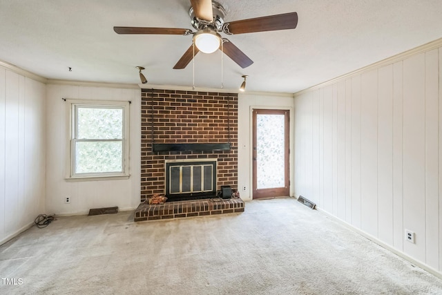 4407 Bromley Dr, Greensboro, NC 27406 - unfurnished living room with crown molding, a fireplace, carpet floors, and a ceiling fan