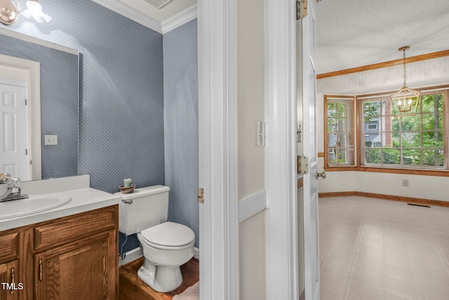 1113 Smokewood Dr, Apex, NC 27502 - bathroom with wallpapered walls, ornamental molding, baseboards, a chandelier, and vanity