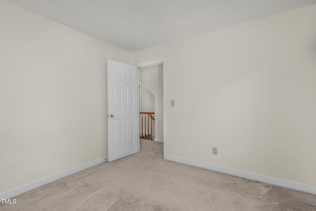 1113 Smokewood Dr, Apex, NC 27502 - spare room with light colored carpet and baseboards