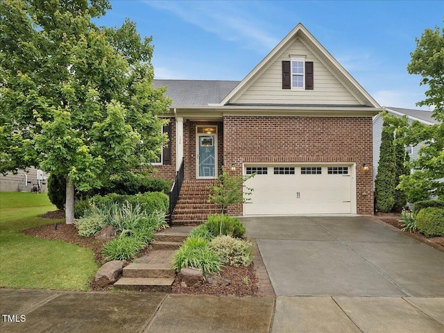 136 Shadow Hawk Dr, Durham, NC 27713 - view of front of home with an attached garage, brick siding, and driveway