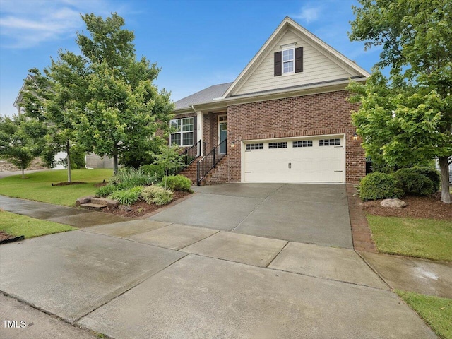 136 Shadow Hawk Dr, Durham, NC 27713 - view of front of property featuring brick siding, concrete driveway, and a front lawn