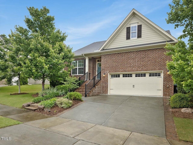 136 Shadow Hawk Dr, Durham, NC 27713 - view of front facade featuring brick siding, a front yard, a garage, and driveway