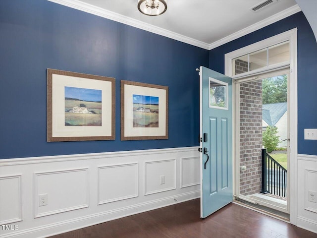 136 Shadow Hawk Dr, Durham, NC 27713 - foyer with ornamental molding, a wainscoted wall, dark wood-style flooring, and a decorative wall