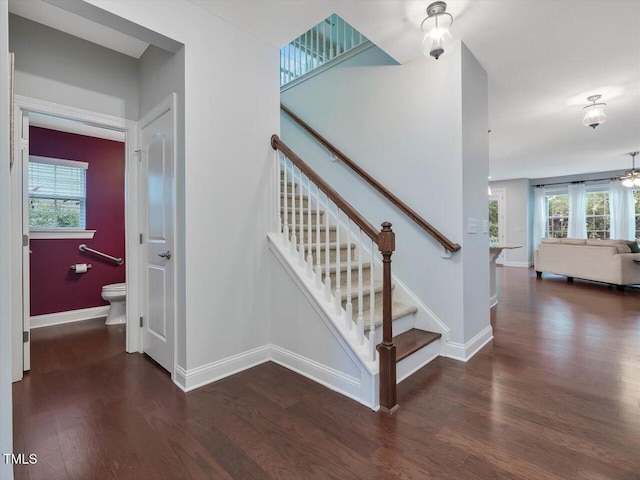 136 Shadow Hawk Dr, Durham, NC 27713 - staircase featuring wood finished floors, baseboards, healthy amount of natural light, and a ceiling fan