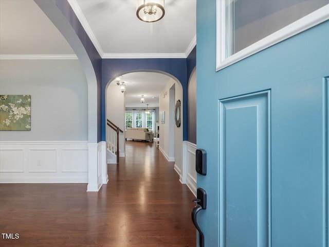 136 Shadow Hawk Dr, Durham, NC 27713 - foyer entrance with crown molding, arched walkways, stairway, and dark wood-type flooring