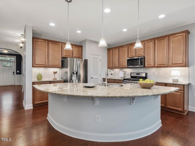136 Shadow Hawk Dr, Durham, NC 27713 - kitchen with stainless steel appliances, a sink, light stone countertops, decorative backsplash, and recessed lighting