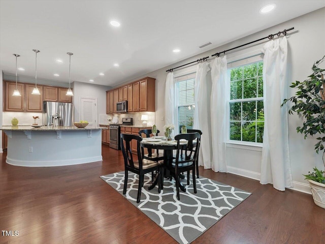 136 Shadow Hawk Dr, Durham, NC 27713 - dining space featuring dark wood finished floors, baseboards, and recessed lighting