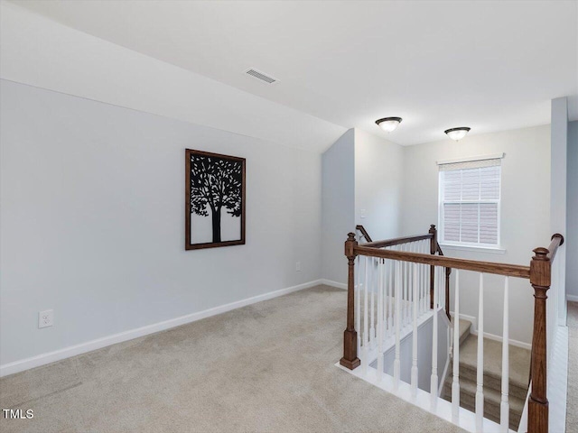 136 Shadow Hawk Dr, Durham, NC 27713 - hall with an upstairs landing, carpet floors, and baseboards