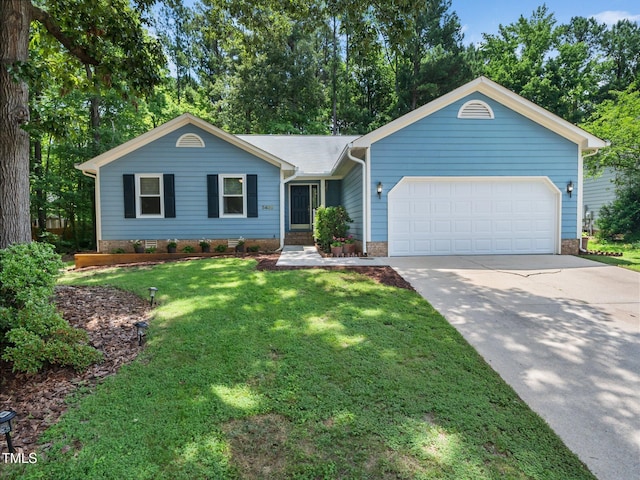 3400 Appling Way, Durham, NC 27703 - single story home featuring a garage, concrete driveway, and a front yard