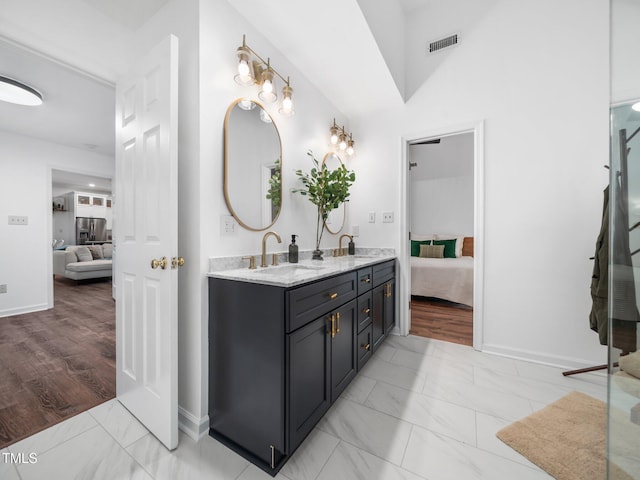 3400 Appling Way, Durham, NC 27703 - bathroom featuring ensuite bathroom, marble look tile flooring, and double vanity