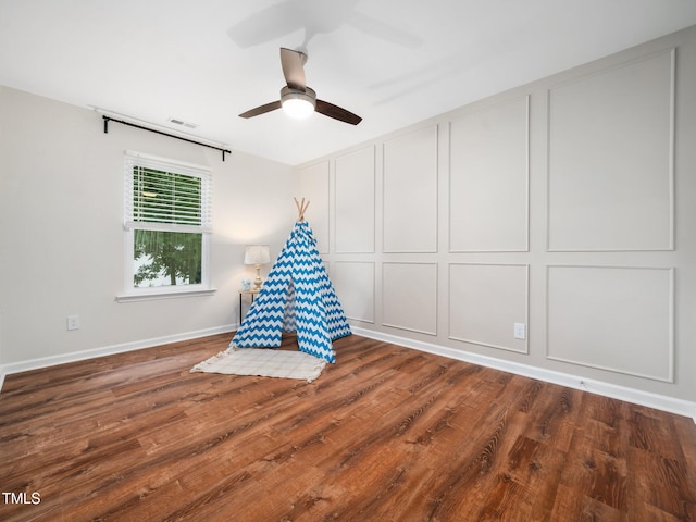 3400 Appling Way, Durham, NC 27703 - rec room featuring a decorative wall, wood finished floors, and ceiling fan