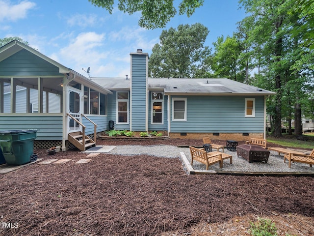 3400 Appling Way, Durham, NC 27703 - back of property with a fire pit, crawl space, a sunroom, a chimney, and a shingled roof