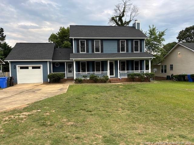 983 Eastment Dr, Fayetteville, NC 28314 - view of front facade with a porch, an attached garage, a chimney, concrete driveway, and a front lawn