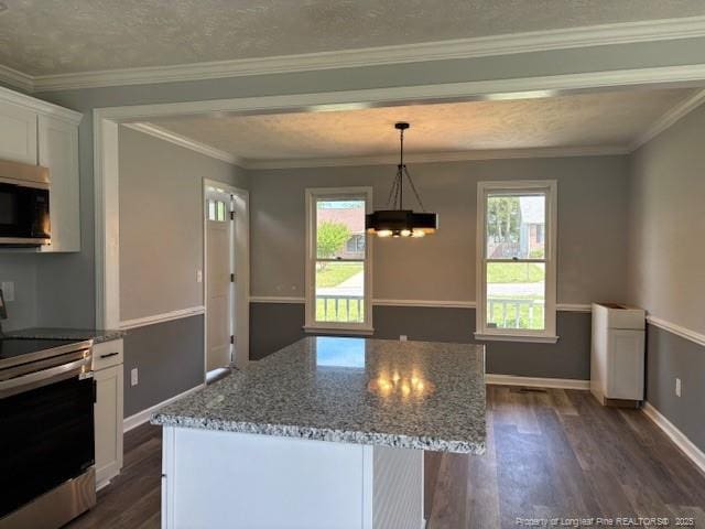 983 Eastment Dr, Fayetteville, NC 28314 - kitchen featuring appliances with stainless steel finishes, dark wood-style floors, a chandelier, white cabinetry, and stone countertops