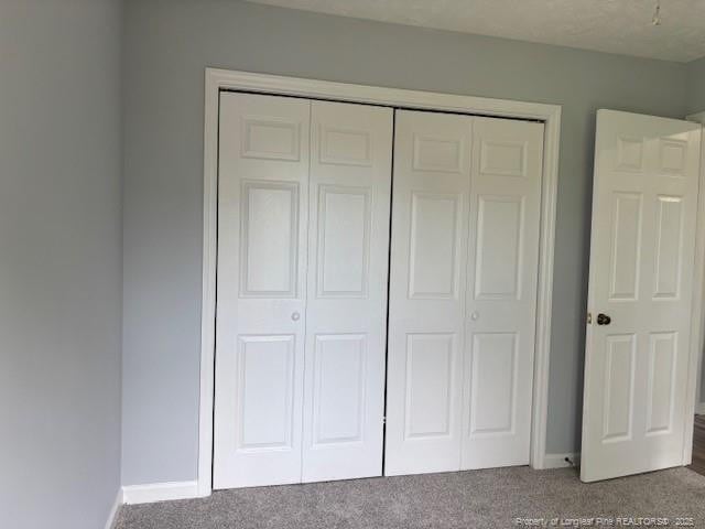 983 Eastment Dr, Fayetteville, NC 28314 - unfurnished bedroom featuring carpet, a closet, and baseboards