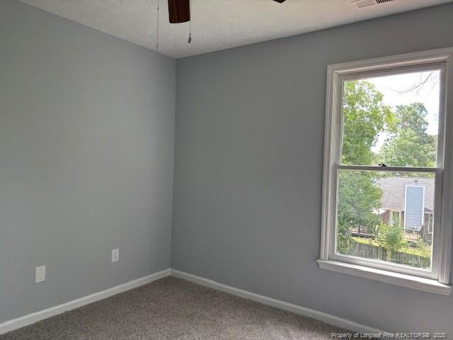 983 Eastment Dr, Fayetteville, NC 28314 - unfurnished room with a ceiling fan, baseboards, and carpet flooring