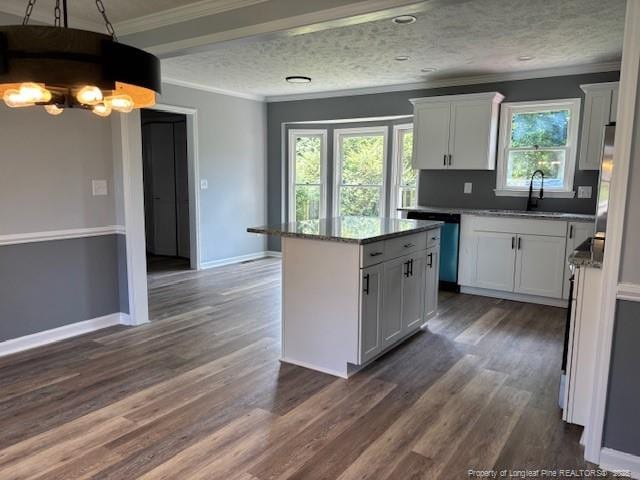 983 Eastment Dr, Fayetteville, NC 28314 - kitchen with a sink, dishwasher, white cabinetry, dark wood-style flooring, and a kitchen island