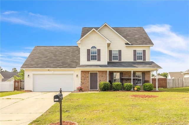5028 Windflower Dr, Fayetteville, NC 28314 - traditional-style house with an attached garage, concrete driveway, a shingled roof, and brick siding