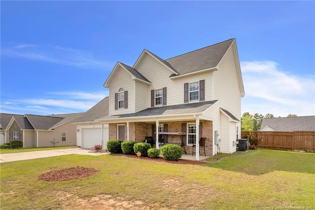 5028 Windflower Dr, Fayetteville, NC 28314 - traditional-style home with covered porch, driveway, central AC unit, and a garage