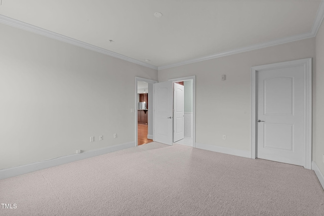 710 Independence Pl Unit 301, Raleigh, NC 27603 - unfurnished bedroom featuring ornamental molding, baseboards, and carpet floors