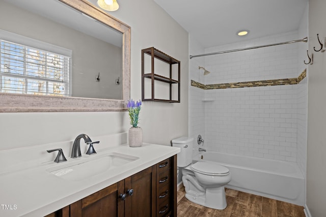 1195 Champion Dr, Cary, NC 27511 - full bath featuring toilet, vanity, washtub / shower combination, and wood finished floors