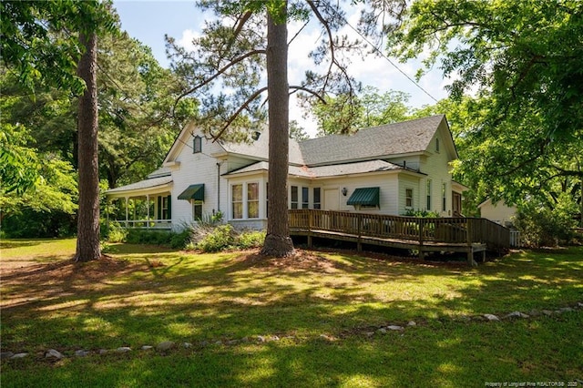 5648 Tolarsville Rd, Saint Pauls, NC 28384 - rear view of house with a yard and a deck