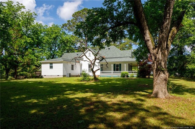 5648 Tolarsville Rd, Saint Pauls, NC 28384 - rear view of property with a yard and crawl space