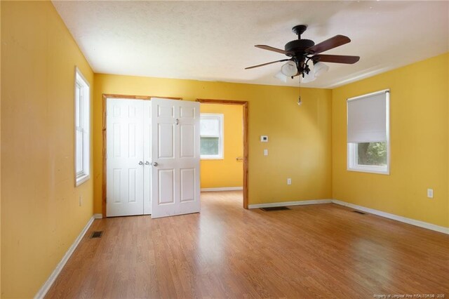 5648 Tolarsville Rd, Saint Pauls, NC 28384 - spare room featuring light wood-type flooring, a ceiling fan, and baseboards