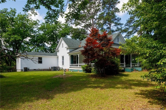 5648 Tolarsville Rd, Saint Pauls, NC 28384 - view of front facade with a sunroom, a front lawn, crawl space, and central AC