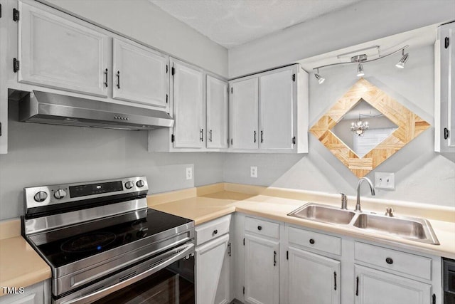 4705 Walden Pond Dr Unit 110-C, Raleigh, NC 27604 - kitchen with stainless steel electric range, under cabinet range hood, a sink, white cabinets, and light countertops