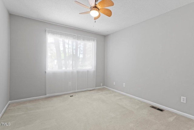 4705 Walden Pond Dr Unit 110-C, Raleigh, NC 27604 - empty room with a ceiling fan, a textured ceiling, carpet, and baseboards