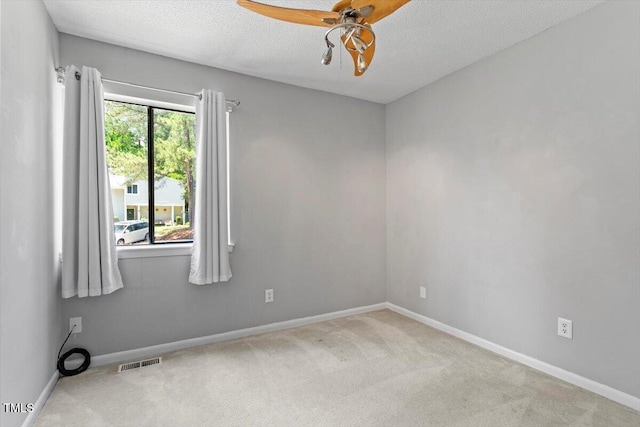 4705 Walden Pond Dr Unit 110-C, Raleigh, NC 27604 - carpeted spare room with ceiling fan, baseboards, and a textured ceiling