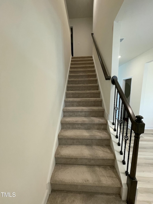 30 Junius Birch Trl, Franklinton, NC 27525 - staircase featuring wood finished floors and baseboards