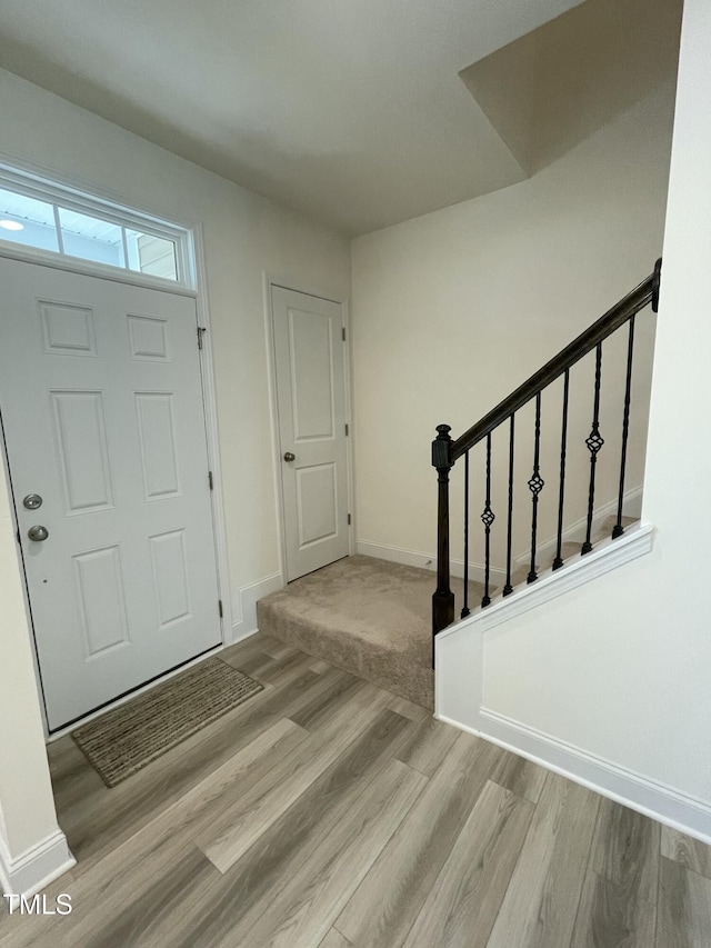 30 Junius Birch Trl, Franklinton, NC 27525 - entryway featuring wood finished floors, baseboards, and stairs