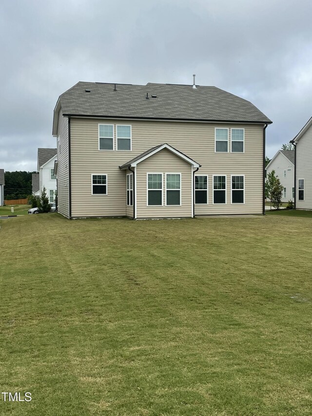 30 Junius Birch Trl, Franklinton, NC 27525 - back of house featuring a yard and a shingled roof