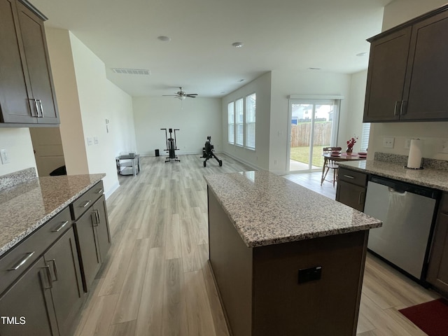 30 Junius Birch Trl, Franklinton, NC 27525 - kitchen featuring dishwasher, a ceiling fan, light wood-style floors, light stone counters, and a center island