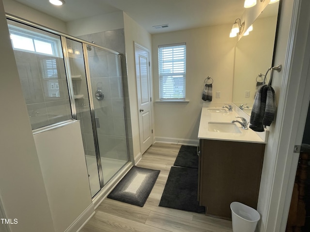 30 Junius Birch Trl, Franklinton, NC 27525 - bathroom with double vanity, healthy amount of natural light, wood finished floors, and baseboards